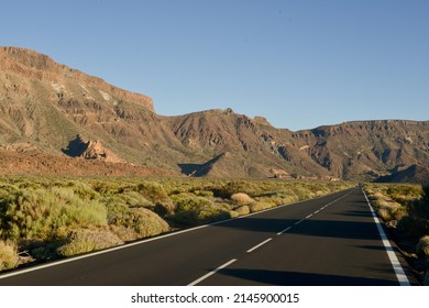 Mountain road from the wild, arid, desert, lunar environment of Teide Volcano, Tenerife, Canary Islands, Spain at sunset