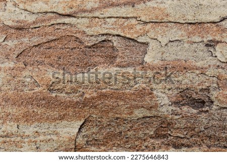 Mountain rock texture. Natural brown slate granite slab marble stone ceramic seamless tile rough surface background. Architecture grunge modern abstract style element. Close-up, copy space