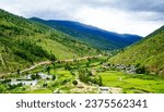 Mountain scenery with green valley in Thimphu, Bhutan. Bhutan is located on the southern slopes of the eastern Himalayas.