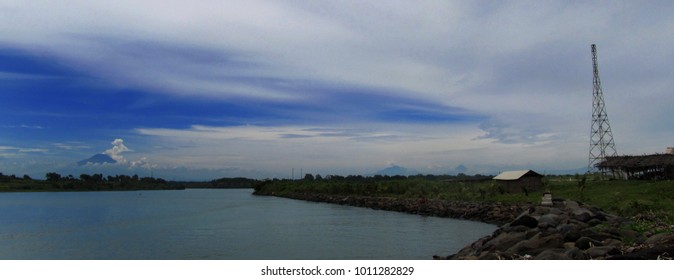           mountain seen from side a river                     