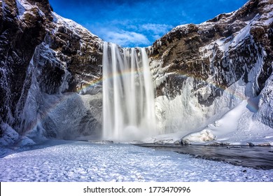 Mountain Seljalandsfoss waterfall in winter snow