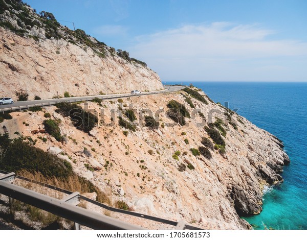 Mountain serpentine road along Mediterranean sea.\
Demre Finike Yolu (road).\
Turkey.