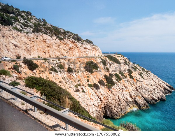 Mountain serpentine road along Mediterranean sea.\
Demre Finike Yolu (road).\
Turkey.