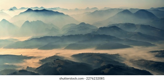 Mountain silhouettes in the fog. Graphic landscape on the theme of mountains - Powered by Shutterstock