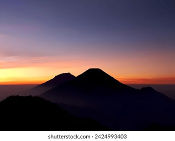 Mountain Silhouettes at Sunset Sky at Prau Mountain Indonesia