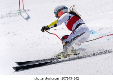 Mountain skier Ekaterina Popova Kamchatka Peninsula skiing down snowy mountain slope. Russian Women s Alpine Skiing Championship, giant slalom. Kamchatka Peninsula, Russian Federation - April 1, 2019