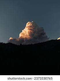 Mountain skyline with clouds at sunset