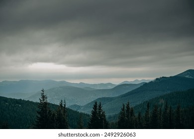 Mountain spring landscape. Overcast weather. The sky is overcast with dark clouds. Beautiful mountain landscape in spring.