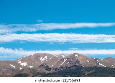 Palandöken Mountain In Spring. Line Shaped Clouds Over The Mountain.