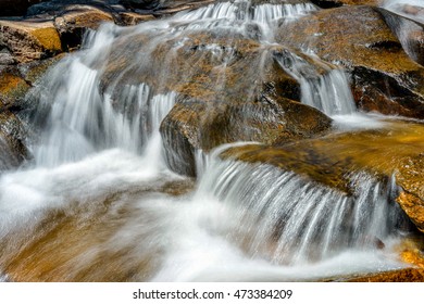 Mountain Stream - Close up view of cascade streams flowing over big rocks in a mountain creek. Rocky Mountain National Park, Colorado, USA.