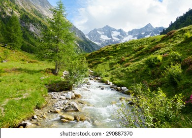 Mountain stream in the high mountains with glaciers