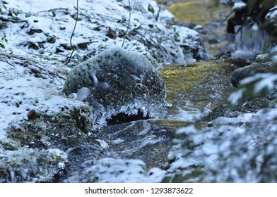 Mountain stream with icicles