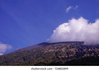 mountain summit with cloudy condition and blue sky background