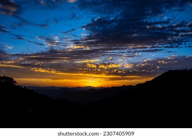 mountain sunset having clouds sky