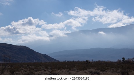 Mountain surrounded by low clouds
