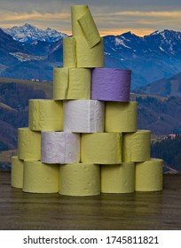 A Mountain Of Toilet Paper On A Background Of Mountains