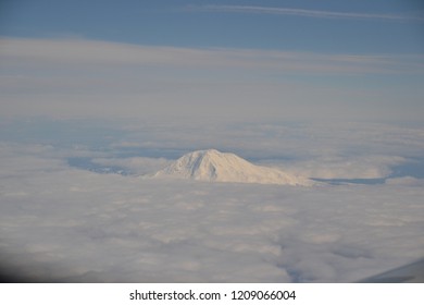 Mountain top over the clouds 