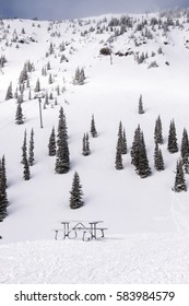 Mountain Top Ski Area With Picnic Table And Chair Lift
