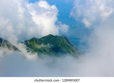 Mountain top surrounded by clouds