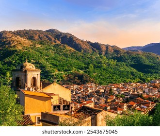 Mountain town view. Mountain landscape of  beautiful village in Sicily, Italy. A town in a beautiful mountain valley. Mountain valley town during sunset in evening light - Powered by Shutterstock