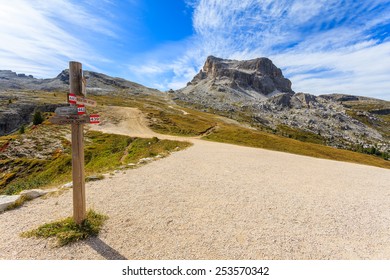 Mountain Trail Sign And View Of Beautiful Landscape In Dolomites Mountains Near Cinque Torri, Italy