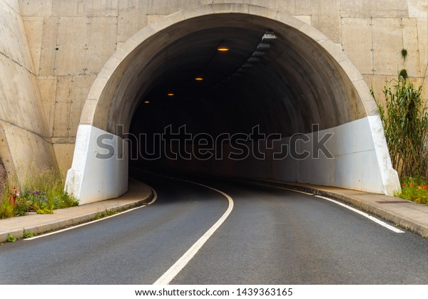 Mountain tunnel road in Madeira island, Portugal.\
The entrance to the\
tunnel.