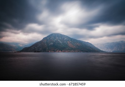 Mountain under cloudy sky