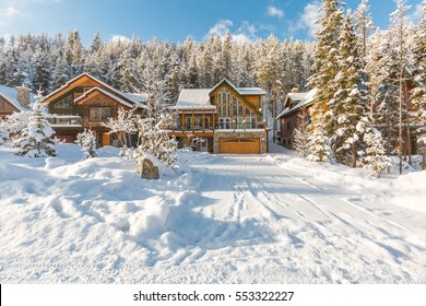 Mountain Vacation Log Houses At Ski Resort Or Golf Course. Winter Wonderland.