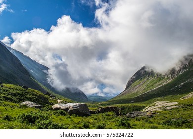 the mountain valley in clouds