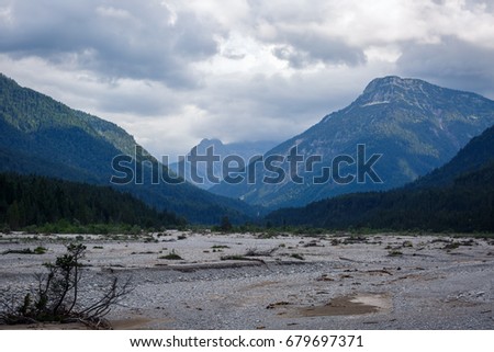 Mountain valley with dried up river bed