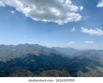 Mountain valley with huge cloud shadow