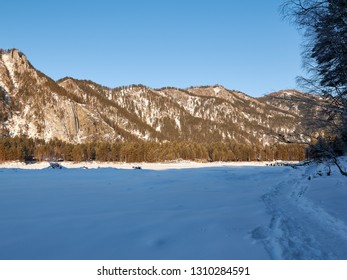 Mountain Valley in winter at sunset
