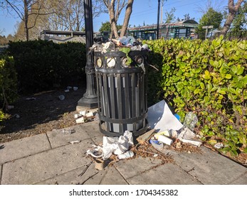 Mountain View, California / USA - April 14 2020 : Overfilled Trash Bin Near The VTA Light Rail Station In Mountain View, CA Amid Coronavirus Lockdown