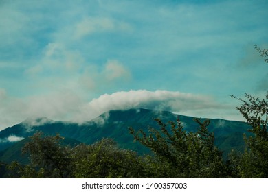 Mountain view with clouds around