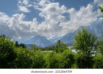 Mountain views landscape in Austria with cloudy blue sky - Shutterstock ID 2312064709