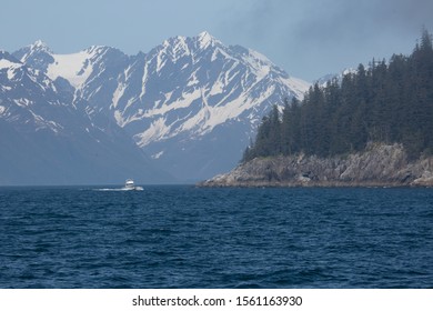 Mountain views snow covered majestic from the waters in Alaska on a boat