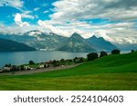 Mountain village. Nature landscape. Nature location in swiss. Switzerland Alps. Mountains near the Lake in Switzerland. Summer landscape with clear mountain lake in the Alps. Location Swiss alps.