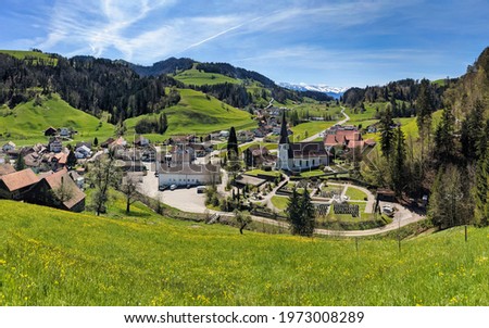 mountain village near zurich switzerland. Toesstal with a view of the snowy mountains. Springtime in backcountry. Swiss
