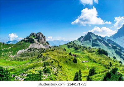 Mountain village on the green hills. Beautiful green mountain hills. Green mountain hills landscape. Mountain summer landscape