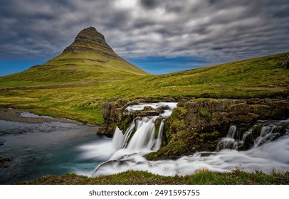 Mountain waterfall in Iceland landscape. Iceland waterfall. Iceland mountain waterfall. Waterfall in Iceland - Powered by Shutterstock