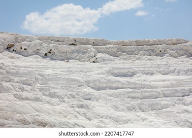 A Mountain Of White Volcanic Limestone Rock Against A Blue Sky. Nature