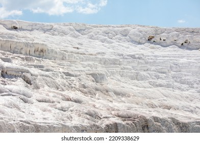 A Mountain Of White Volcanic Limestone Rock Against A Blue Sky. Nature