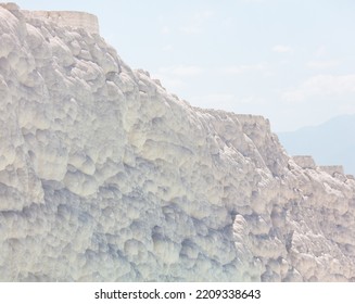 A Mountain Of White Volcanic Limestone Rock Against A Blue Sky. Nature