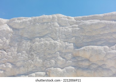 A Mountain Of White Volcanic Limestone Rock Against A Blue Sky. Nature