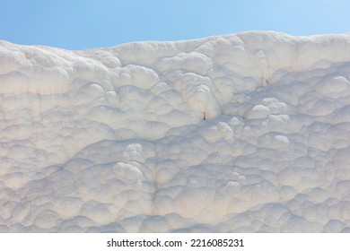 A Mountain Of White Volcanic Limestone Rock Against A Blue Sky. Nature