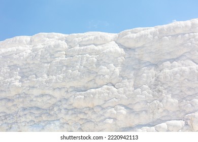 A Mountain Of White Volcanic Limestone Rock Against A Blue Sky. Nature