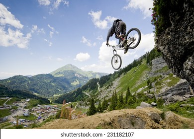 Mountainbiker jumping from a rock - Shutterstock ID 231182107
