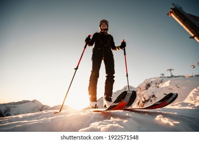 Mountaineer backcountry ski walking in the mountains. Ski touring in high alpine landscape. Adventure winter extreme sport. Sunny day