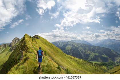 Mountaineer Hiking Over A Ridge In The Alps, Austria