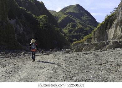 Mountaineer Trekking Across Mount Pinatubo Valley Over Lahar And Pyroclastic Flow Remnants From Its Historic Eruption In 1991
